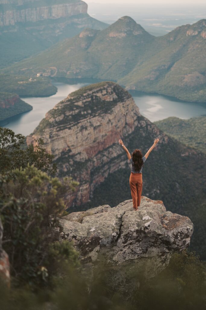 Photo by Taryn Elliott: https://www.pexels.com/photo/a-woman-standing-on-a-rock-in-a-mountain-landscape-4840245/